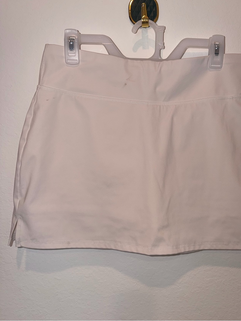 Calvin Klein Performance women's athletic skort in a clean, minimalist white hue